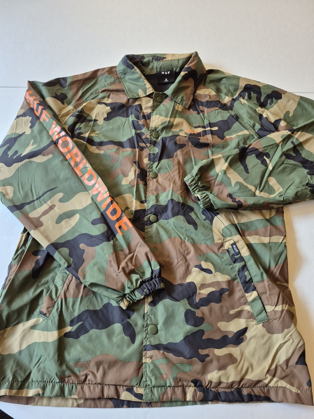 HUF Camo Lightweight Jacket with Orange HUF Worldwide Script 4888